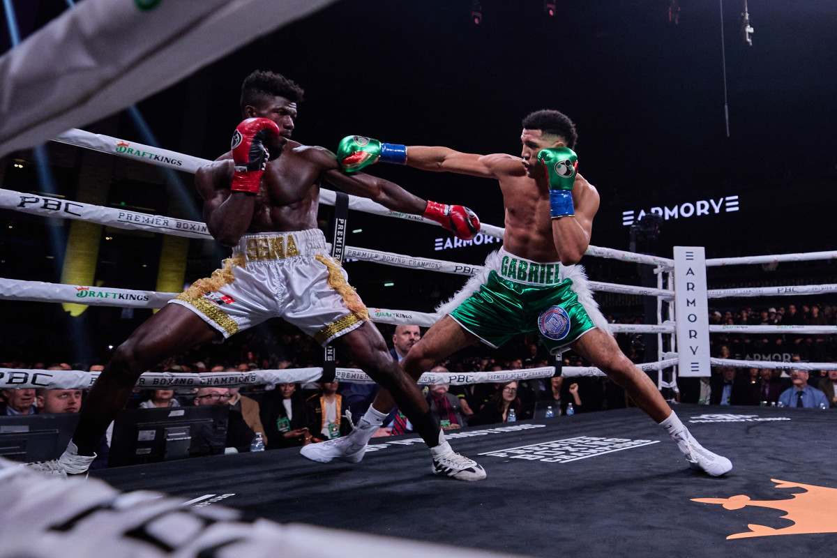 Morrell punches at Agbeko during their match.